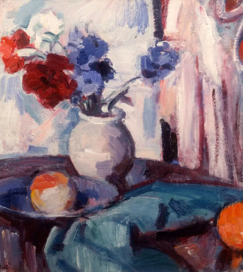 Bouquet d'œillets et de bleuets dans un vase