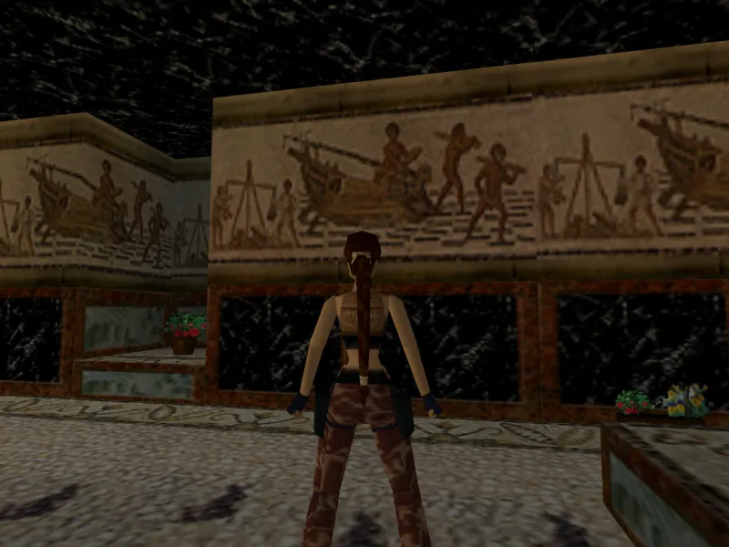 Capture d'écran du jeu Tomb Raider III. On y voit le personnage de Lara Croft dans son manoir, devant une mosaïque reprenant les motifs d'une mosaïque romaine découverte à Sousse, qui représente le déchargement d'un navire marchand